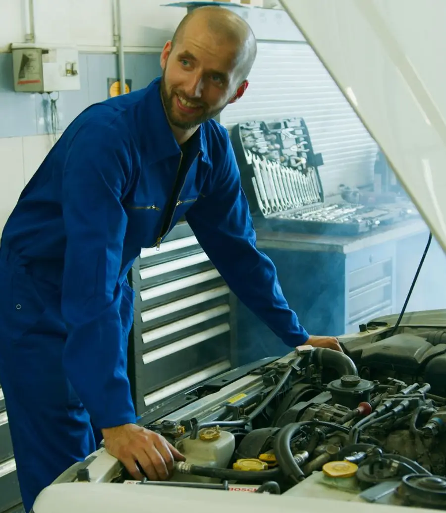 Service advisor at a workshop booking desk