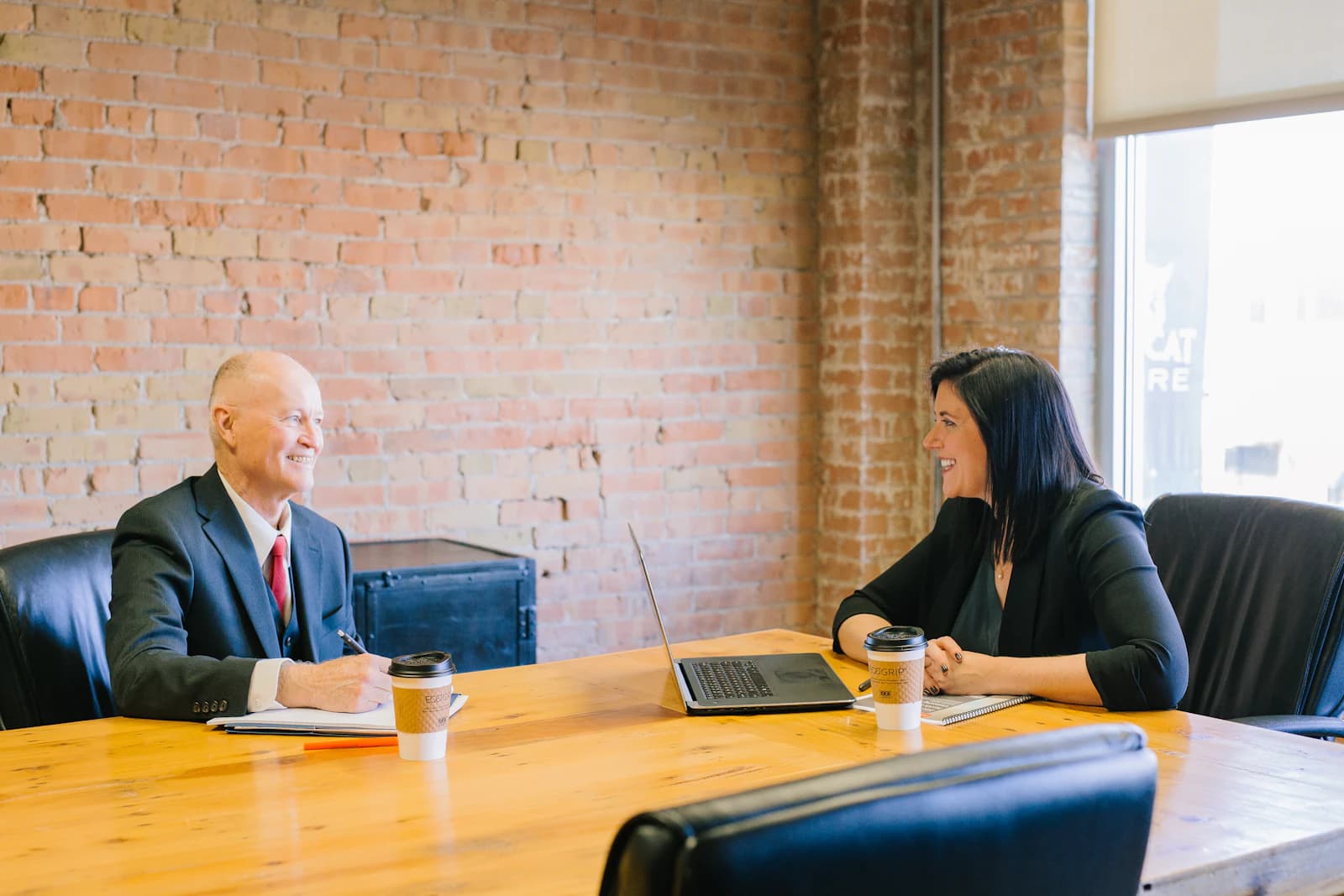Lawyer meeting a client across a table
